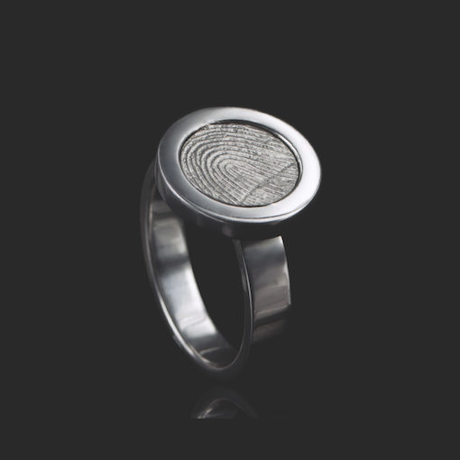 Zilveren ring met ronde vingerafdruk en 5 zirkonia stenen